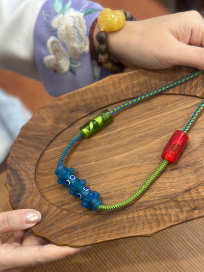 Hand-Knotted Dragonfly Eye Glass Necklace – Blue Red Green Contrast Woven Cord Jewelry