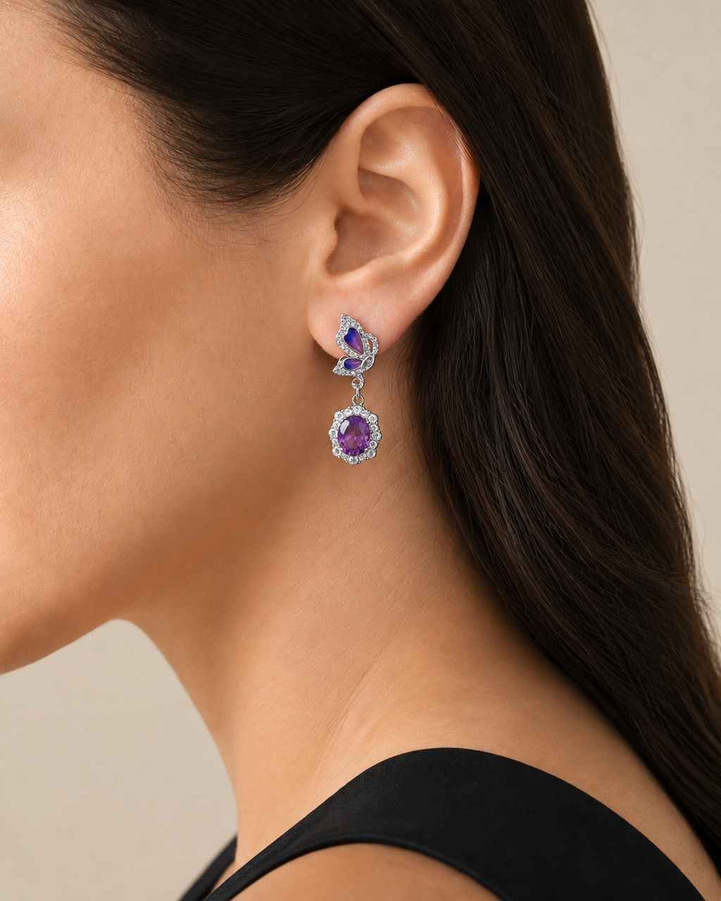 Amethyst butterfly dangle earring in 925 sterling silver worn on a model, side view