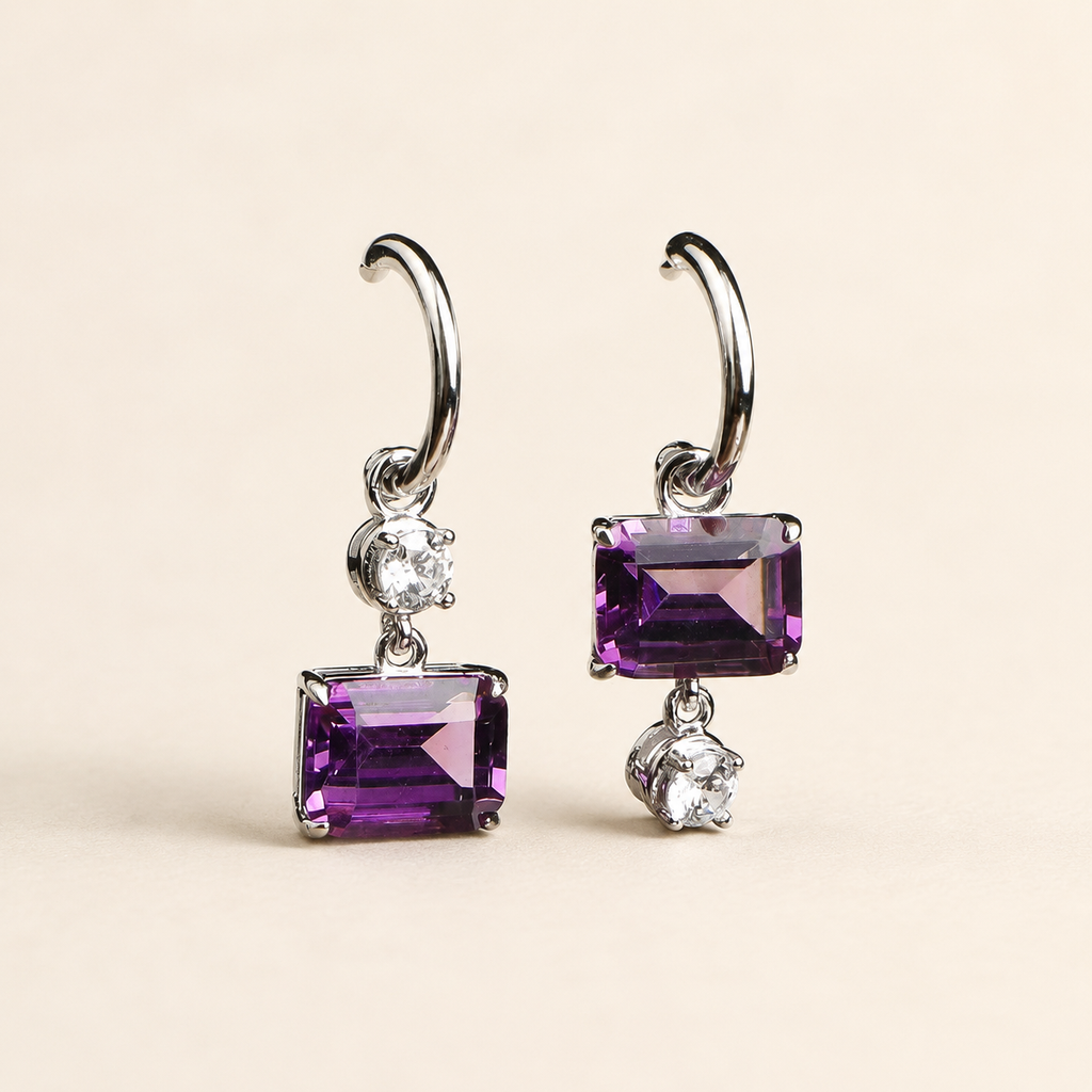 Natural amethyst drop hoop earrings on a warm ivory background