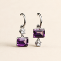 Natural amethyst drop hoop earrings on a warm ivory background