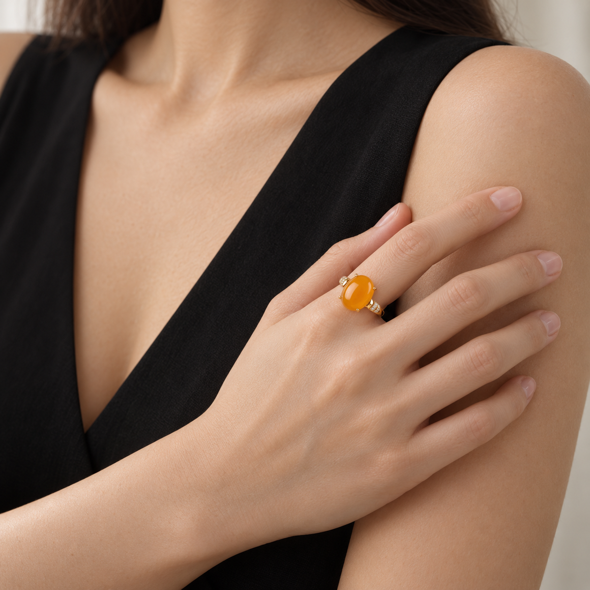 Natural amber statement ring styled with a black dress