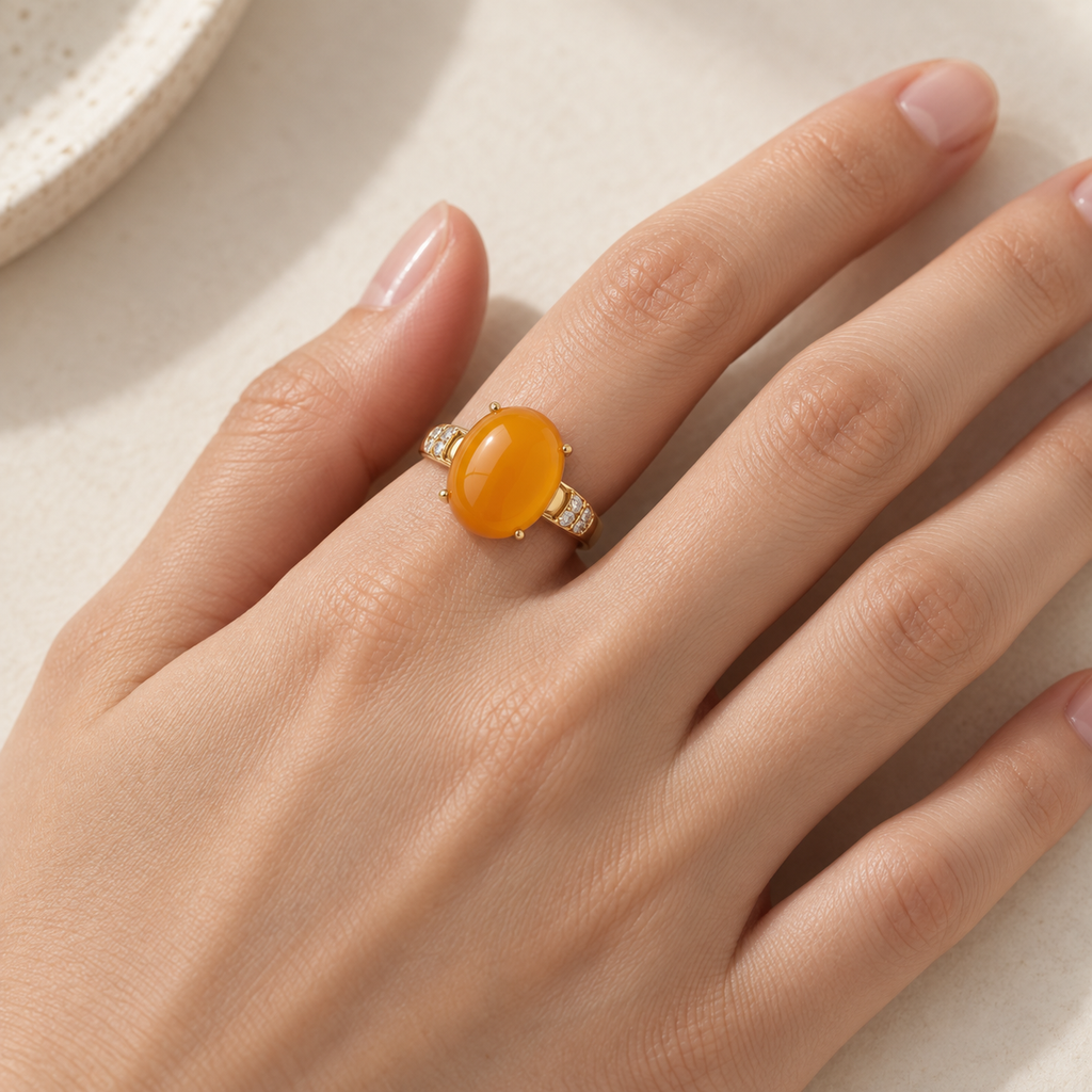 Natural amber statement ring worn on hand