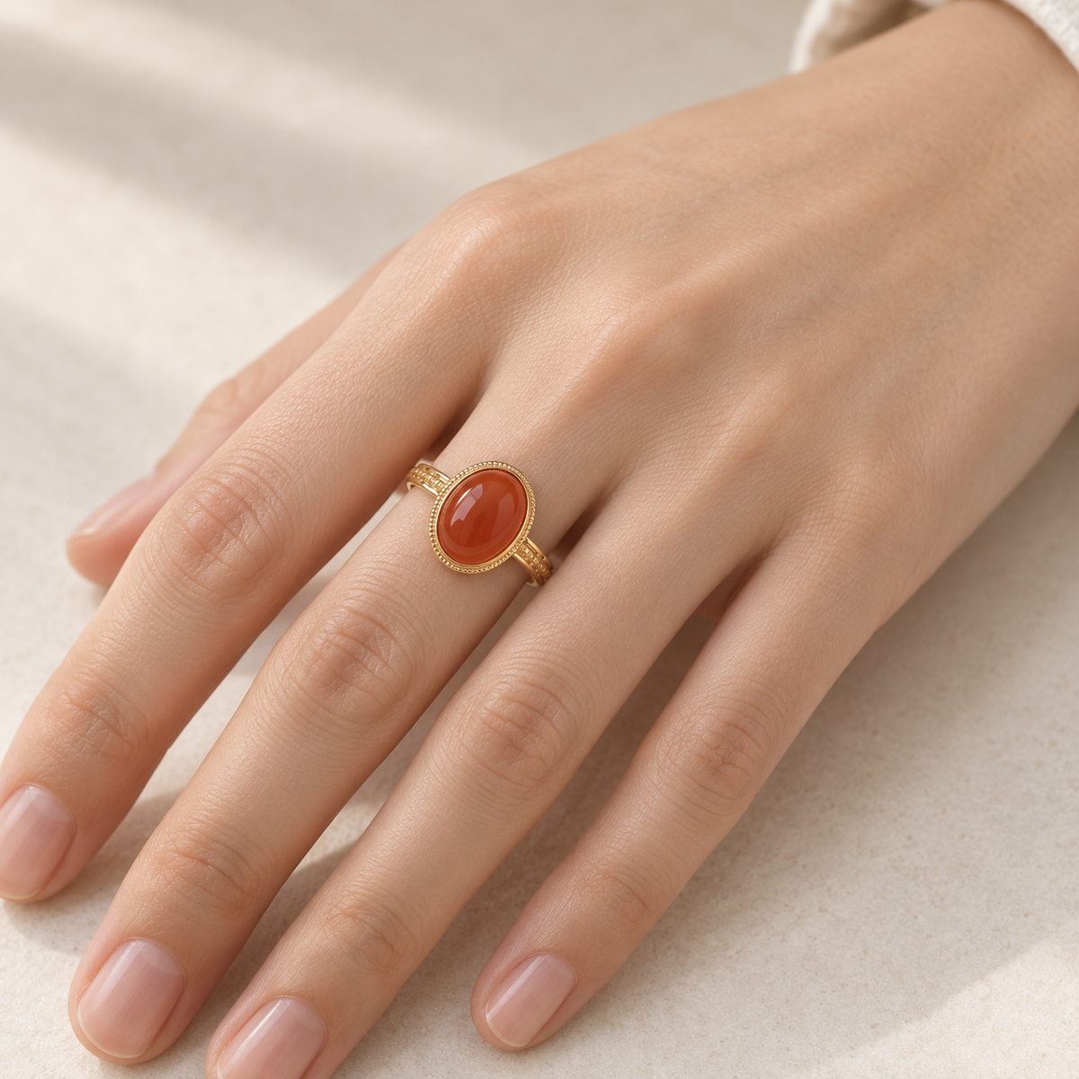 Natural red agate statement ring worn on hand