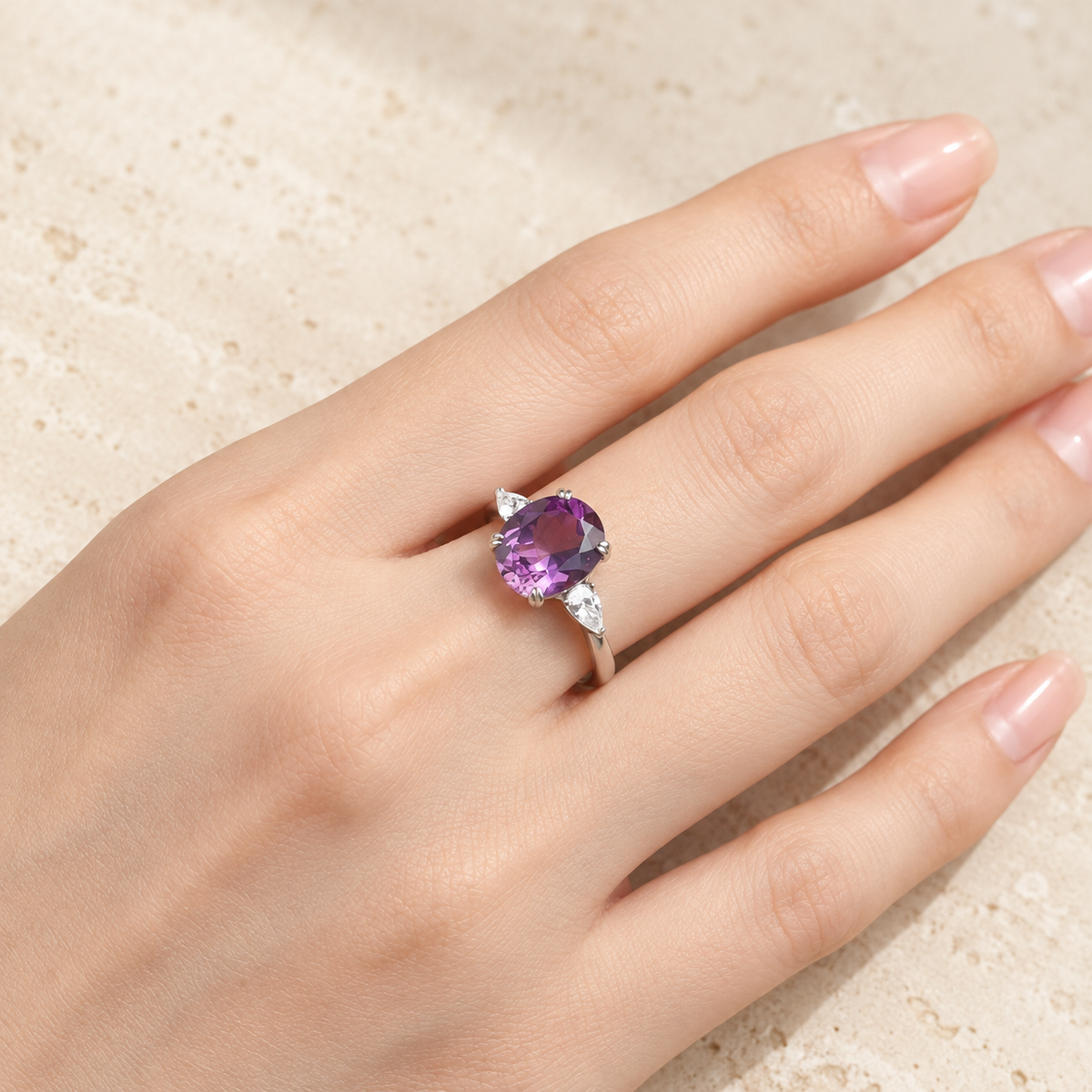 Natural Uruguayan amethyst three stone ring worn on hand