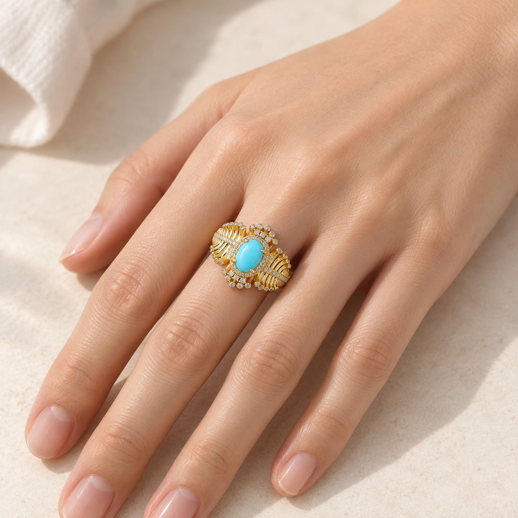 Turquoise fishbone statement ring worn on hand