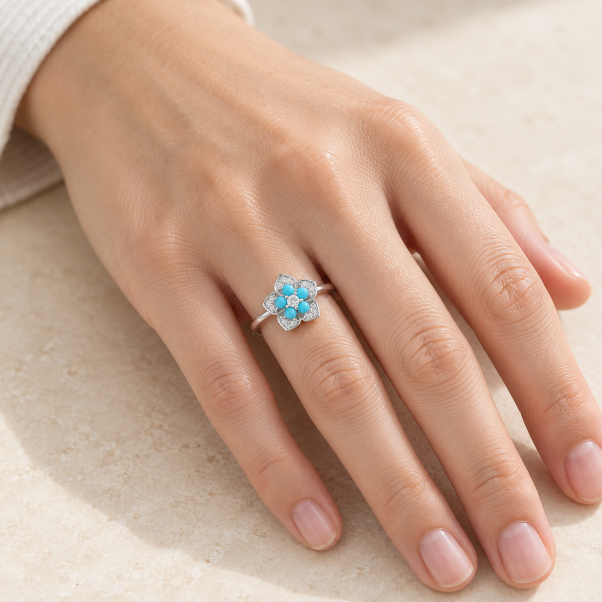 Natural turquoise flower ring worn on hand