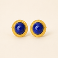 Natural lapis lazuli stud earrings on a warm ivory background