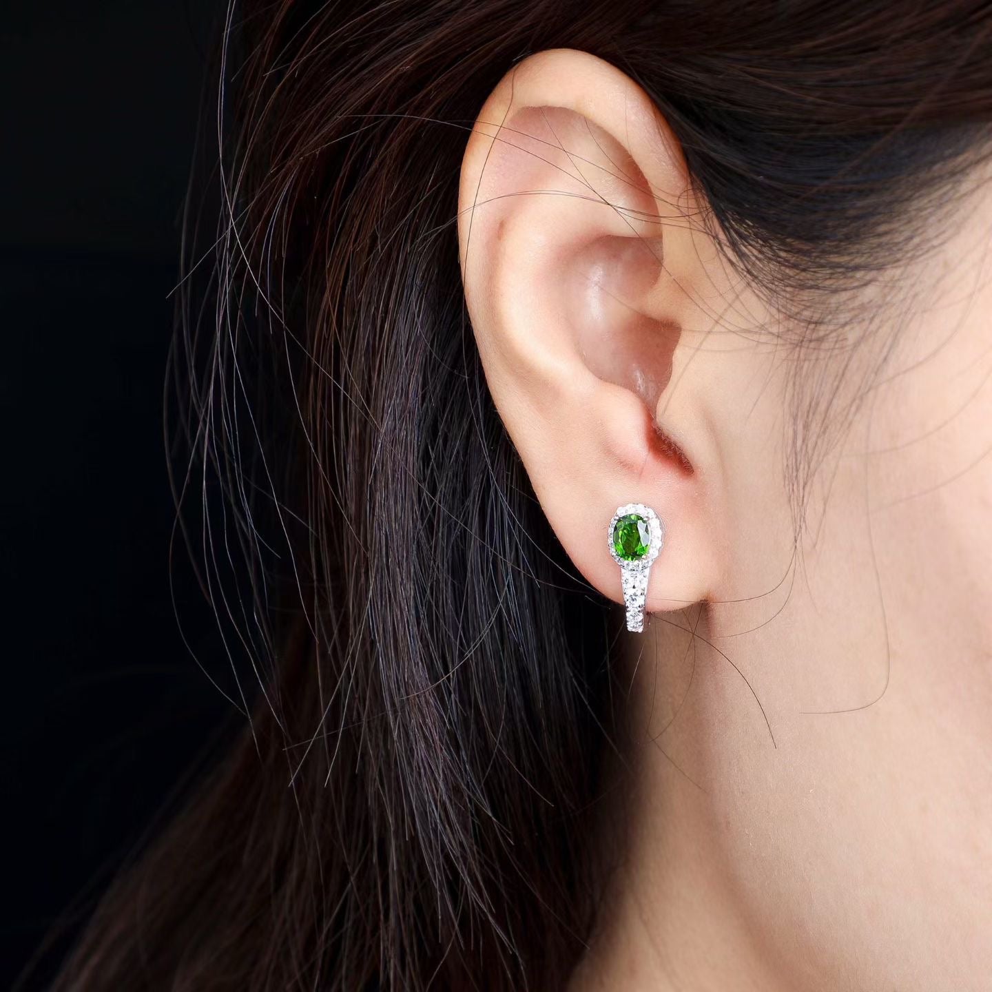 Natural chrome diopside halo earrings in 925 sterling silver worn on ear