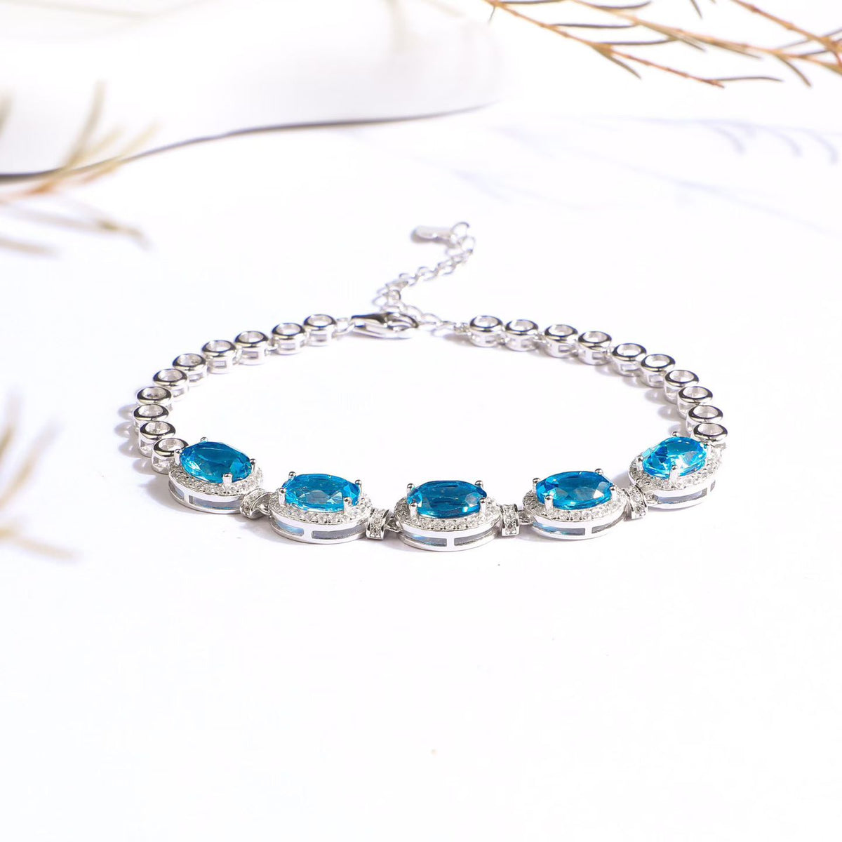 Natural Swiss blue topaz bracelet, oval gemstone setting and link detail