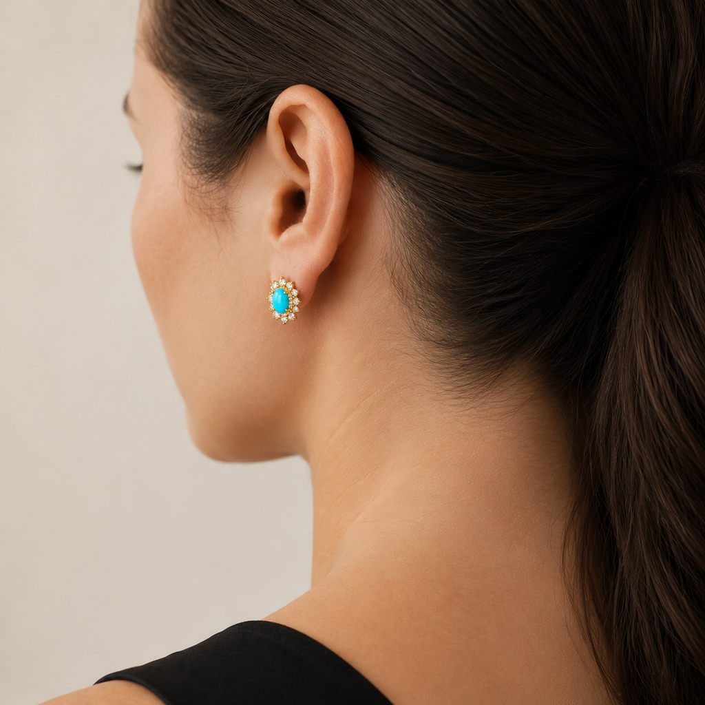 Natural turquoise halo stud earring worn on a model, rear three-quarter view