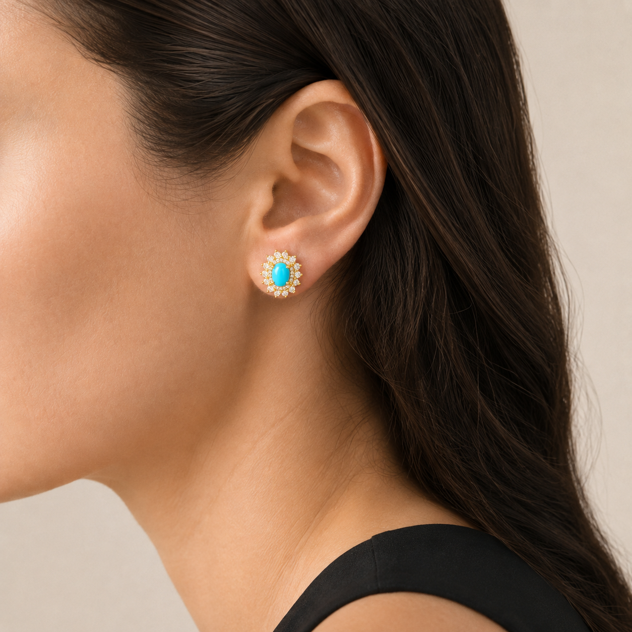 Natural turquoise halo stud earring worn on a model, side view